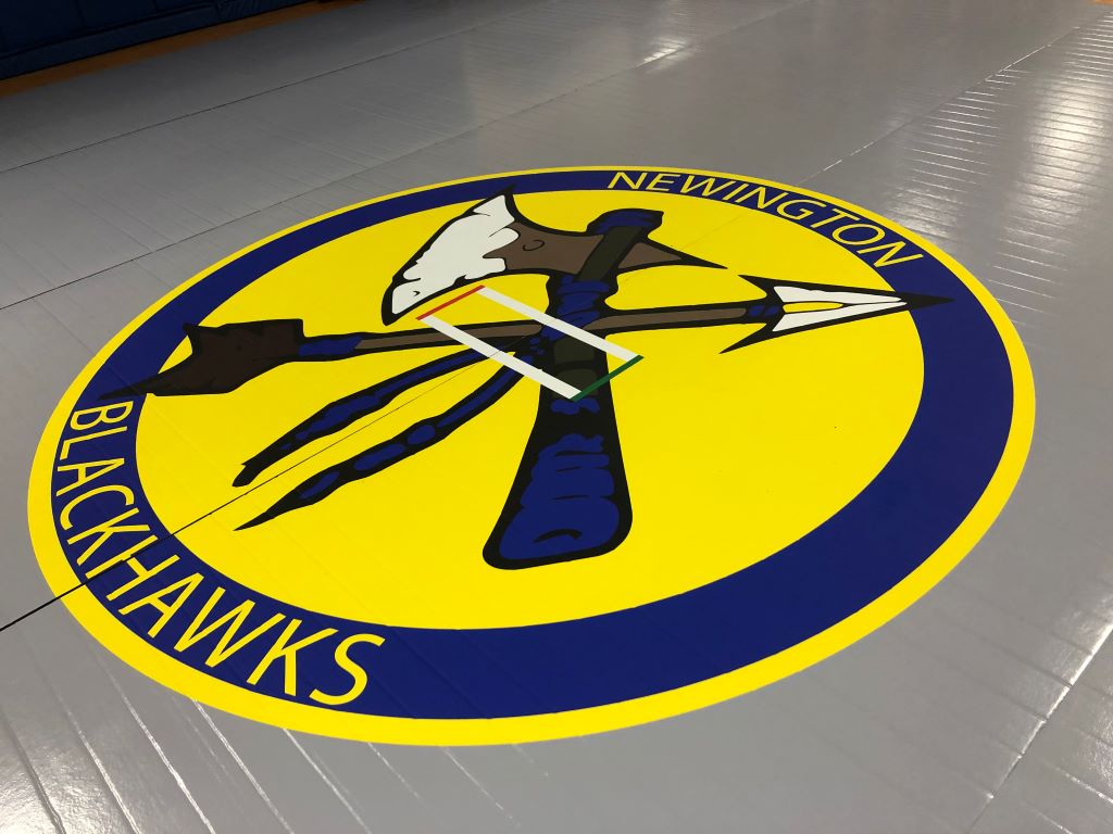 High school logo on competition mat 