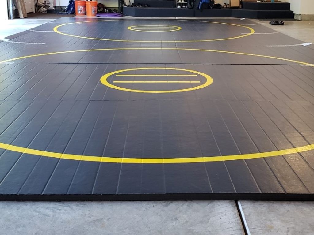 black wrestling mat in home garage for after school training 